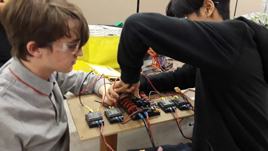 Students working on motor controllers